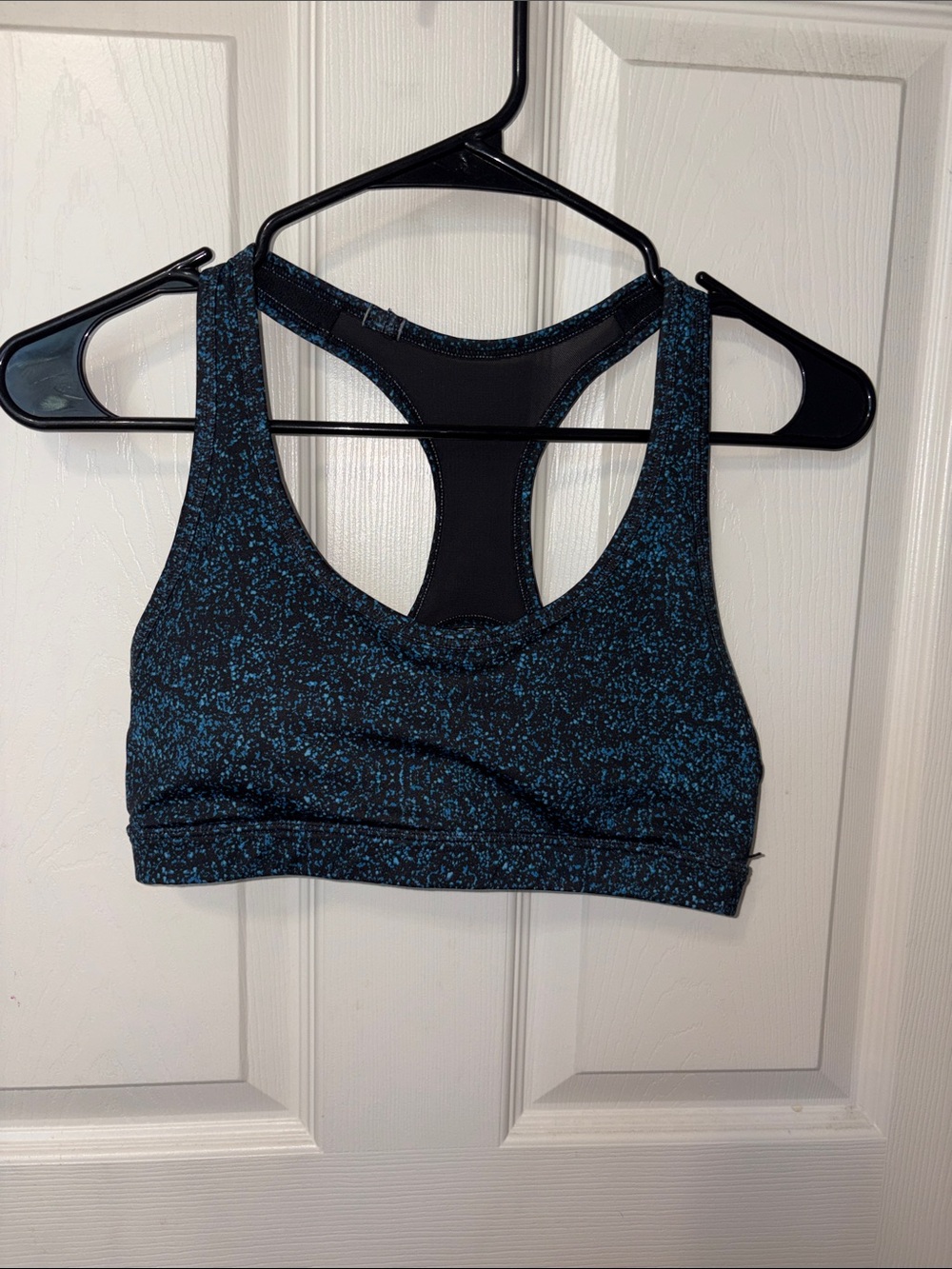 S blue and black open back sports bra